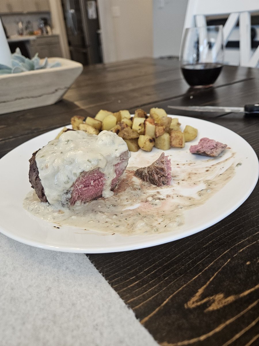 8 ounce filet, blue cheese sauce, greasy potatoes, red wine. 

20 years of wedded bliss and only her steak topping has changed.