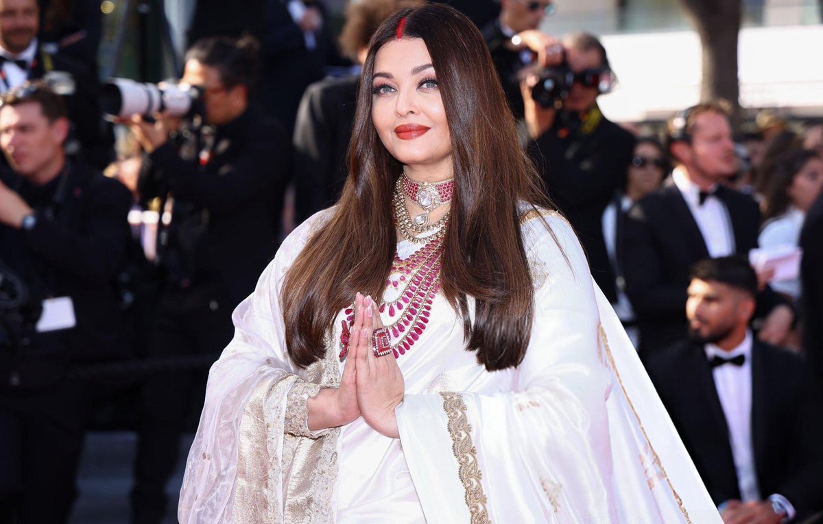 At Cannes 2025, Aishwarya Rai Bachchan once again proved why she’s  an icon on the global stage. Dressed in a stunning ivory and gold saree by Manish Malhotra, she turned heads not just with her elegance but with a bold swipe of sindoor — a powerful symbol of Indian tradition.