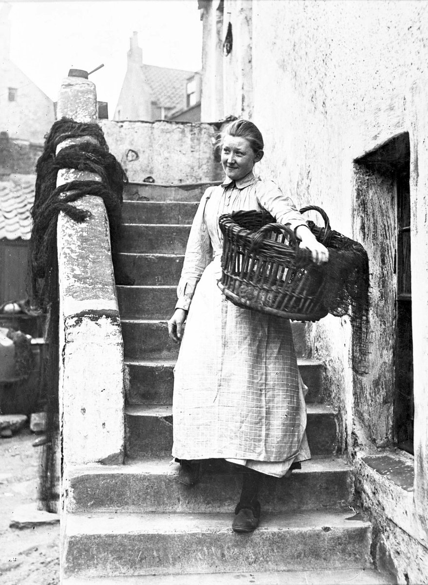 A woman carrying a basket containing a fishing net, c1930s. I'm not cetain of the location but I think it might be Cromarty

[source: Highland Collection, <a href="/edcentrallib/">Central Library</a>]