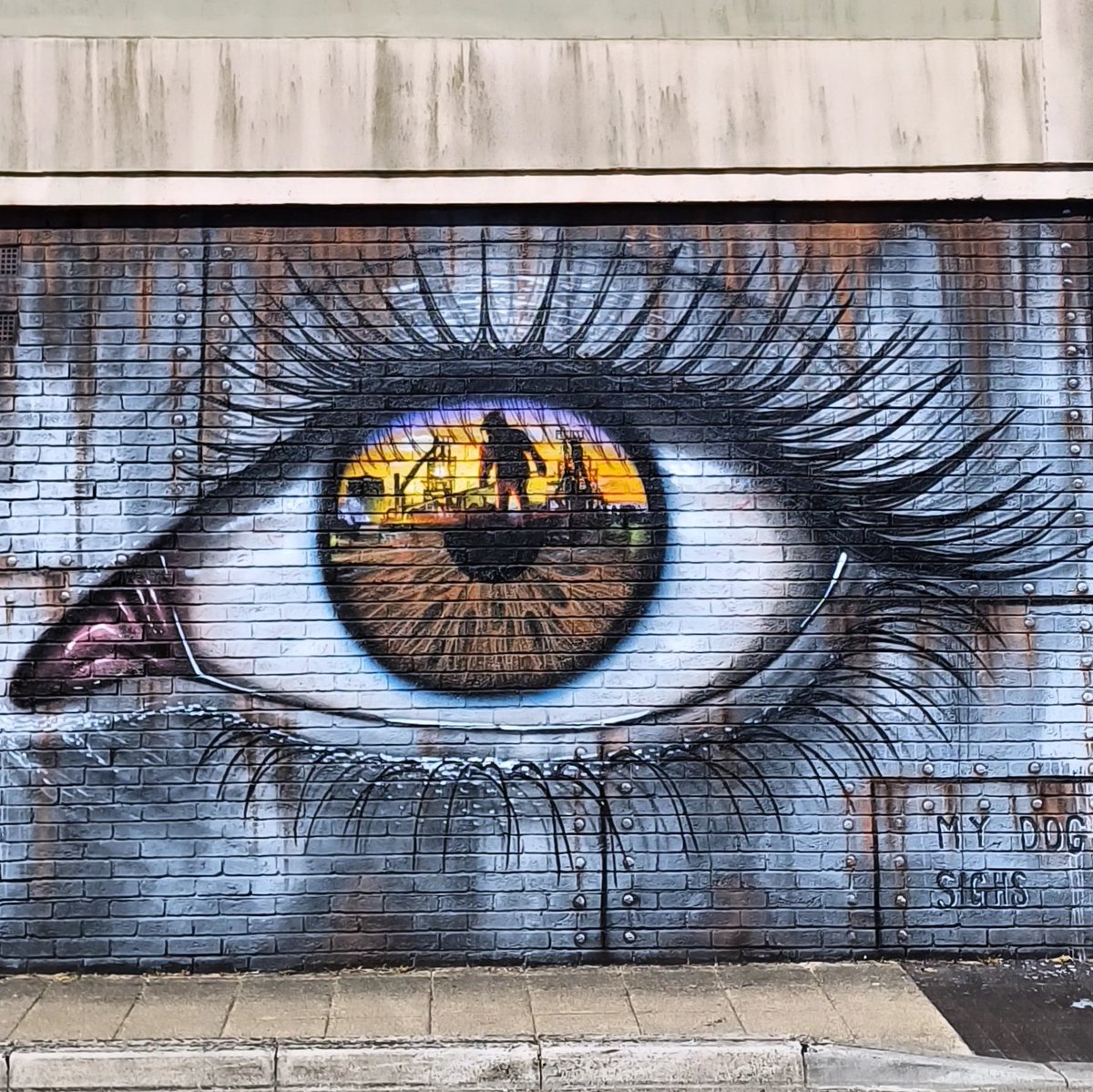 Mark Rees (@reviewwales) on Twitter photo An Eye on the Steelworks 👁️
This new mural by My Dog Sighs turns a brick wall into a sheet of painted steel from which an eye peers out — and in its pupil, the sun sets on Port Talbot’s steelworks.
Commissioned by ArtWalk Port Talbot, it honours a town built on steel.
#Wales #Art An Eye on the Steelworks 👁️
This new mural by My Dog Sighs turns a brick wall into a sheet of painted steel from which an eye peers out — and in its pupil, the sun sets on Port Talbot’s steelworks.
Commissioned by ArtWalk Port Talbot, it honours a town built on steel.
#Wales #Art