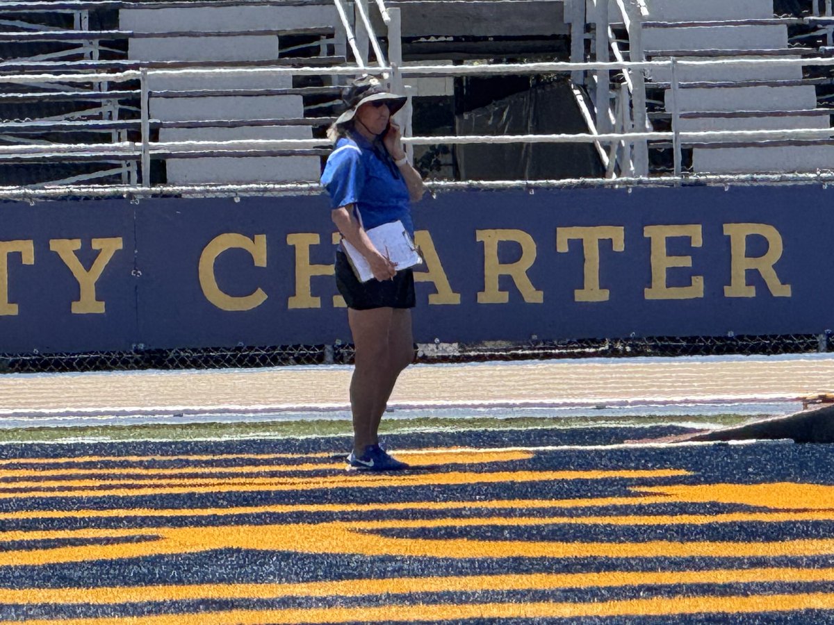 The City Section commissioner knows how to multi task. She’s handling the pole vault while running the meet and on the phone, too.