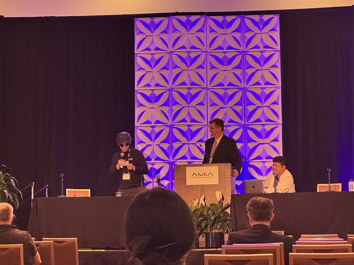 bspartridgeCIS's tweet photo. @brianclaymd playing Dr. Suits during and AI use case skit at #CIC25 and Niko pulling out every EM stereotype in the book 😂 It’s been a long time since I have laughed so hard during an academic presentation #AMIA https://t.co/1Sq2IntKfB