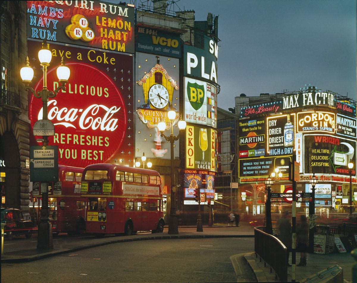Neon lights dazzle above Piccadilly Circus. Zoom in for incredible detail. A Kodachrome image taken in 1965.