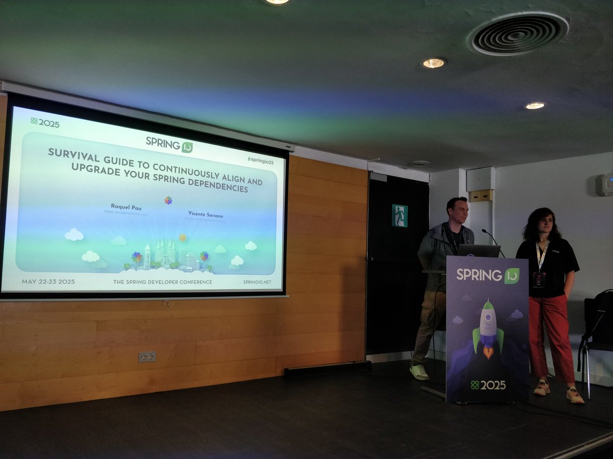 <a href="/raquelpau/">Raquel Pau</a> &amp; #vicente_soriano preparing to show us how to handle Spring upgrades! #springio25 go team!