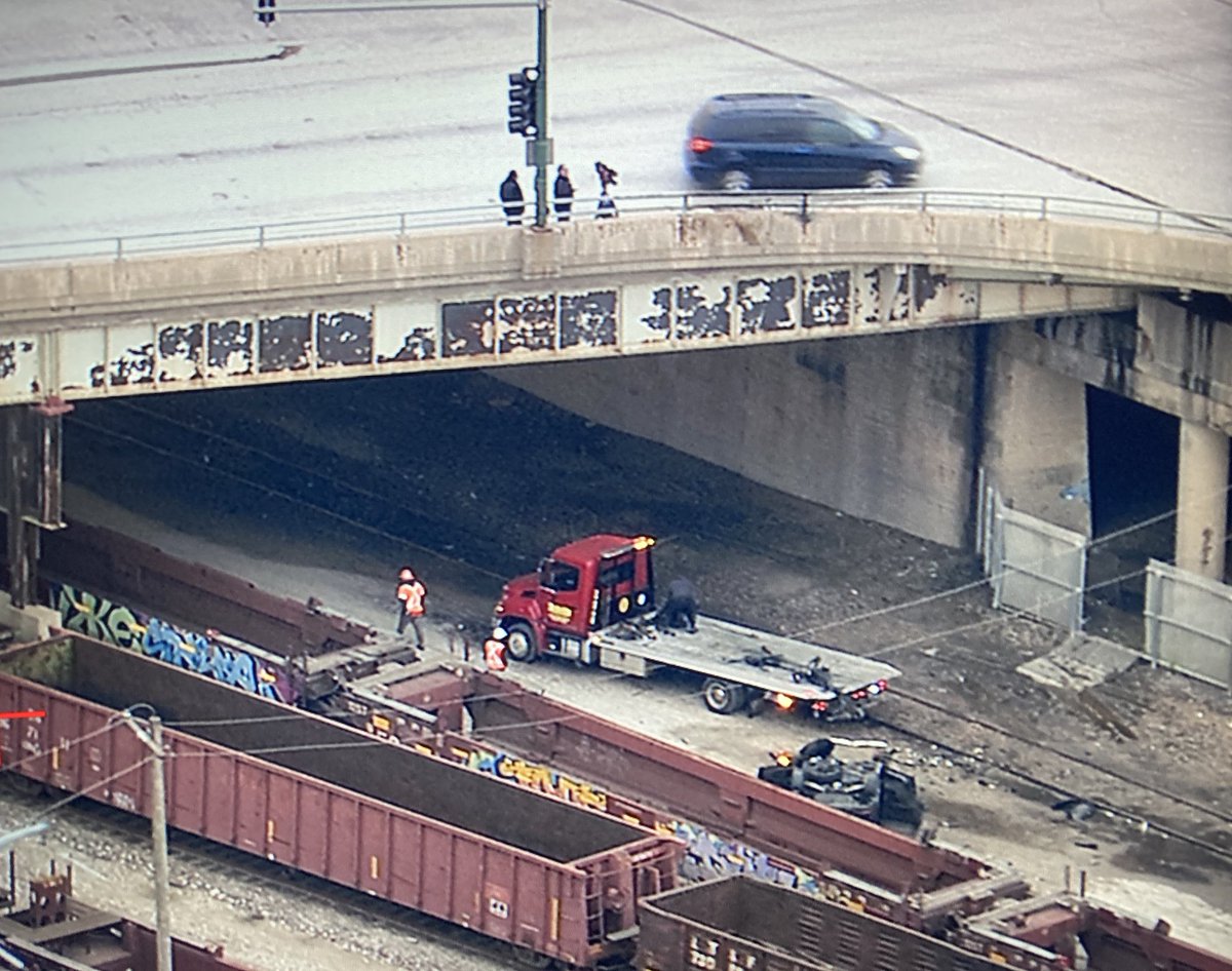 Police still on scene investigating a wild early morning crash involving a stolen car. Driver drove off the Pulaski overpass on I-55, ended up on its roof on the BNSF tracks below, &amp; caught fire. The driver managed to get out of the car &amp; fled the scene.