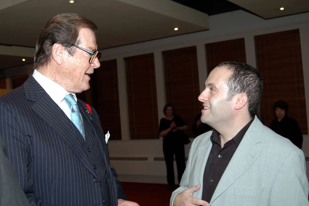 Morris Bright MBE (@morrisbrightmbe) on Twitter photo Eight years since we lost Roger Moore. Here at <a href="/ElstreeStudios/">Elstree Studios</a> in 2006, five days before I was getting married.
"Getting married? What number?" Roger asked
"Two!"
"Take my advice, cut out the middleman and give her the house now!"
And we laughed.
(I'm not laughing as much now!) Eight years since we lost Roger Moore. Here at <a href="/ElstreeStudios/">Elstree Studios</a> in 2006, five days before I was getting married.
"Getting married? What number?" Roger asked
"Two!"
"Take my advice, cut out the middleman and give her the house now!"
And we laughed.
(I'm not laughing as much now!)