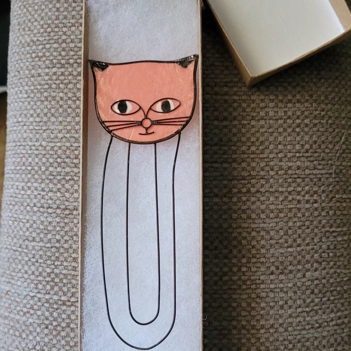 Cute and I like cats, but I remember when bookmarks were solid, made of card or cloth, and didn't come in a little coffin.