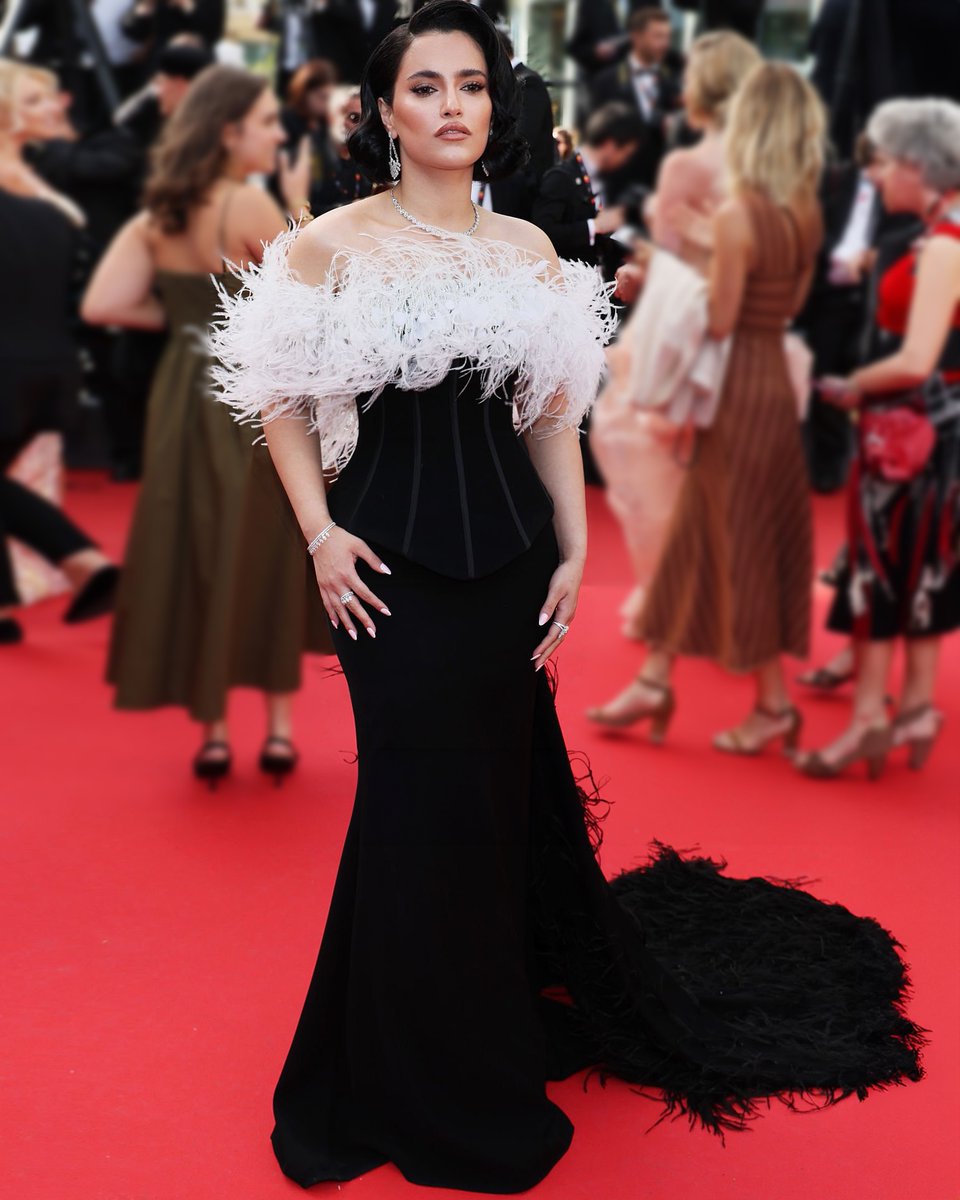 #YusurAlKhalidi graces the “La Venue De L’Avenir” red carpet during the 78th <a href="/Festival_Cannes/">Festival de Cannes</a> in a custom black gown featuring a structured corset, embroidered off-shoulder neckline, and dramatic overskirt .

#Cannes2025 #78thCannesFilmFestival
#YusurAlKhalidi #RamiKadi #Cannes