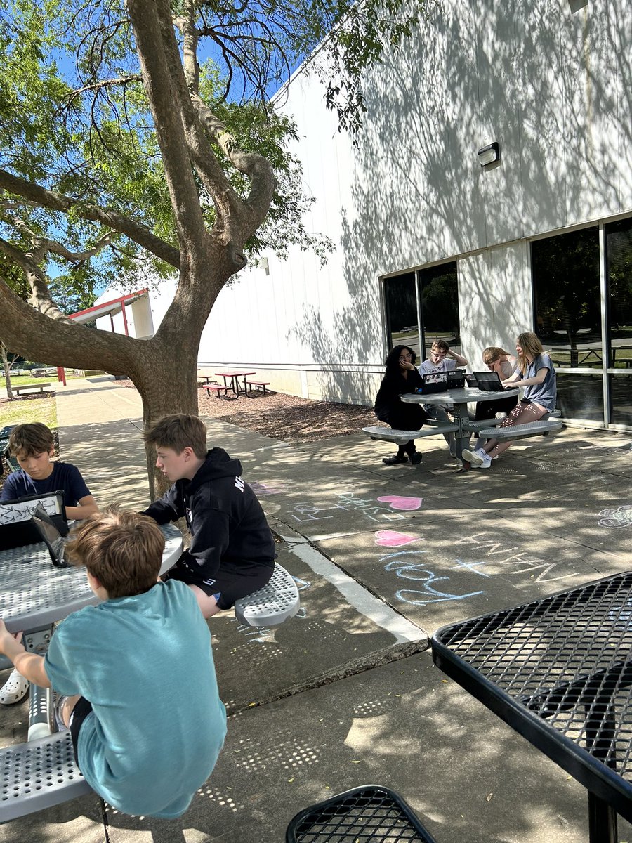 MsStoneELA's tweet photo. Took advantage of the sunshine and brought class outside today ☀️ Nothing like discussing dystopian futures with birds chirping in the background! #ELA https://t.co/KmZZyHXggq