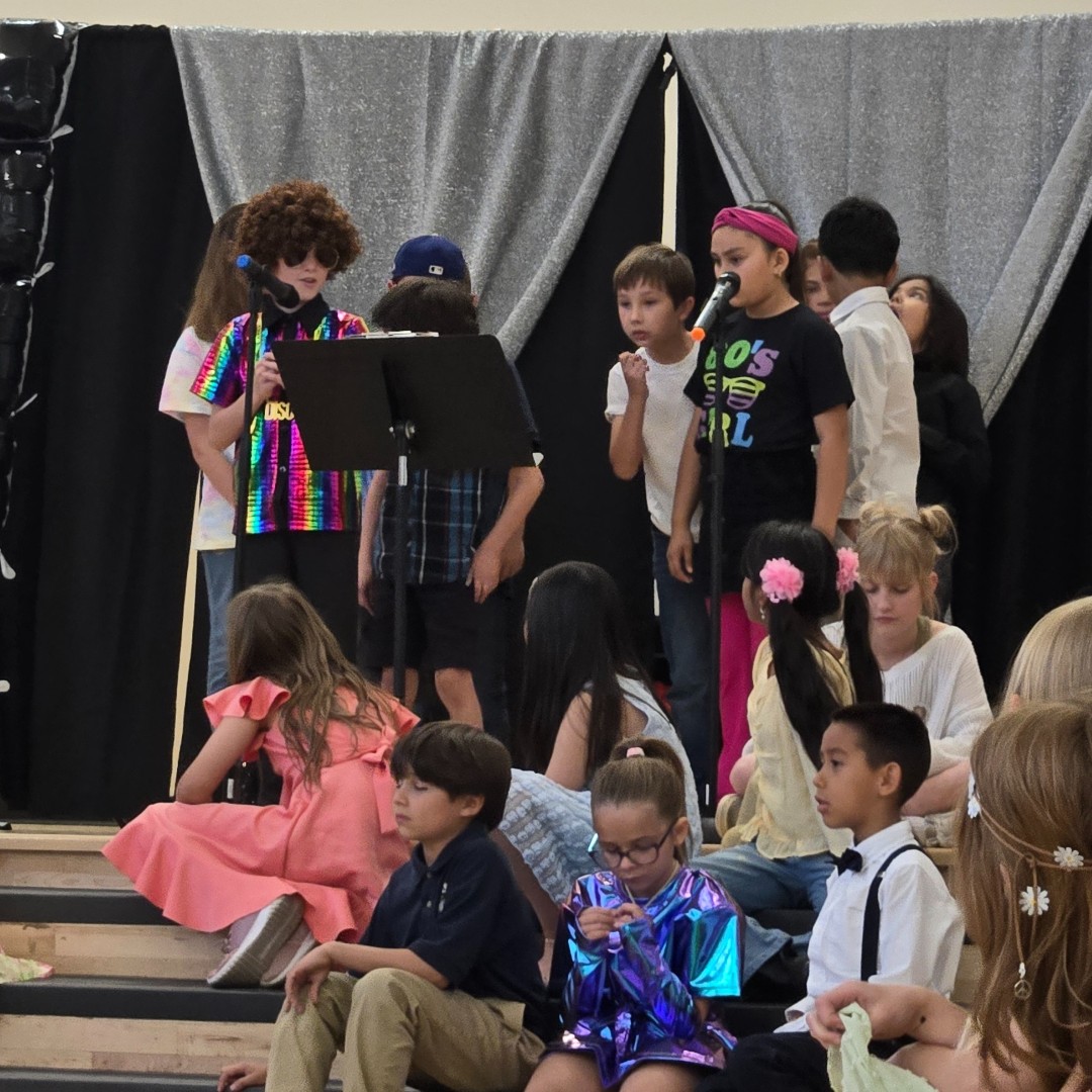 SSATucson's tweet photo. 🎶 Our 3rd &amp; 4th graders rocked the stage with their '80s-themed spring concert! 🌟 They were also honored with special awards celebrating their hard work this year. What a fun and memorable way to wrap up the year! #SpringConcert #StudentSuccess #EndOfYearCelebration https://t.co/tGhXeMQTHK