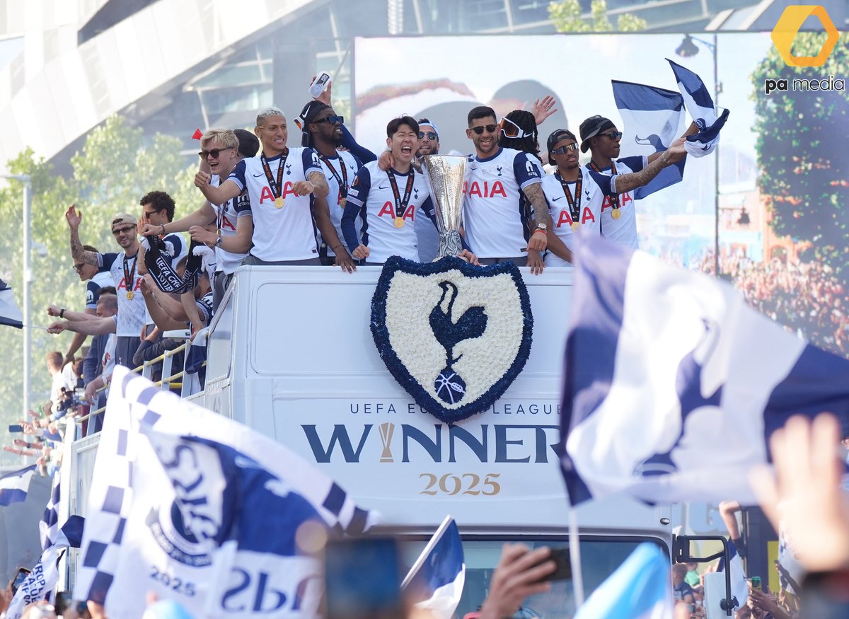 Fans cheer on Tottenham Hotspur players and staff, who celebrate on an open-top team bus during the Europa League winners parade in North London, after winning the Europa League final against Manchester United 1-0 in Bilbao on Wednesday. #COYS #EuropaLeagueChampions #football