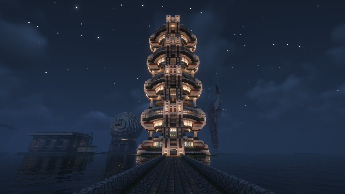 🌌 As night falls, stars and lanterns guard this towering pixel beacon above the water.
Here, every floor is a step toward the future.