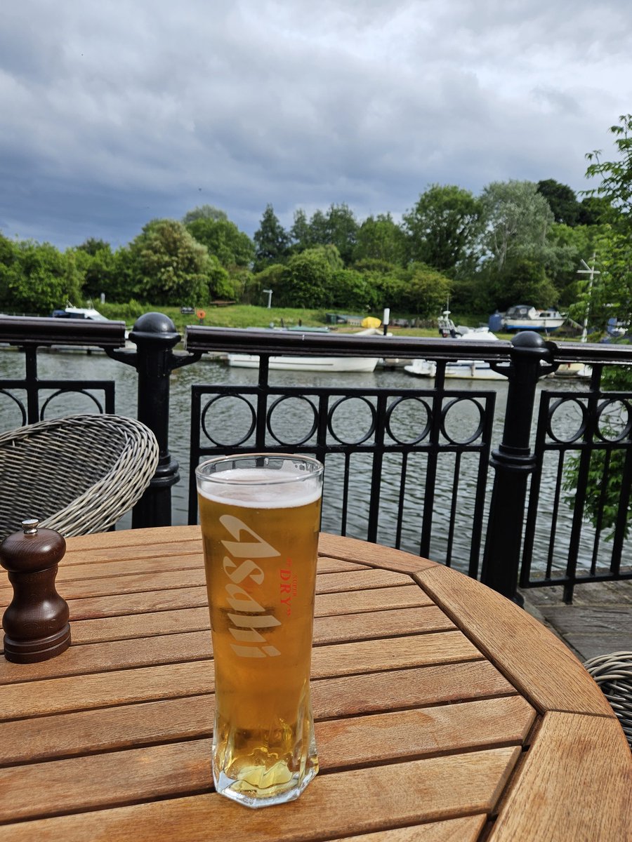 Enjoying a pint by the Thames