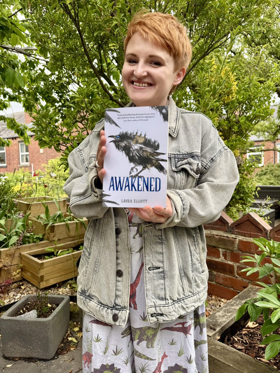 had to do a little photoshoot with a finished copy!!!! 🐦‍⬛ 

Awakened is out on June 10th and available to pre-order here: linktr.ee/lauracelliott