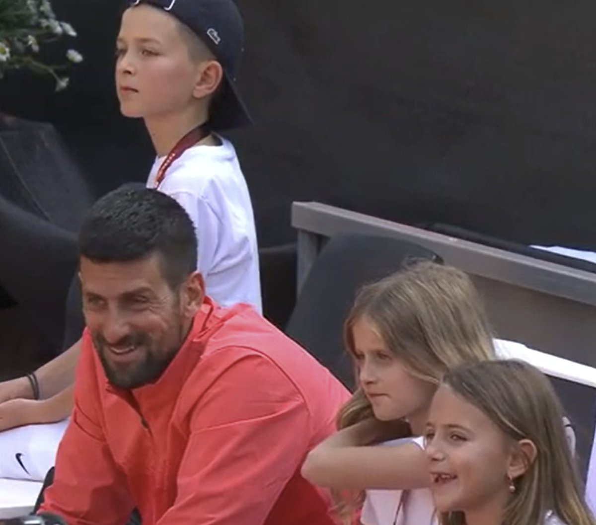 Tennis_Now's tweet photo. ADORABLE. Century man Novak Djokovic chats with his kids after winning title No.100! https://t.co/1oagB0QwZK