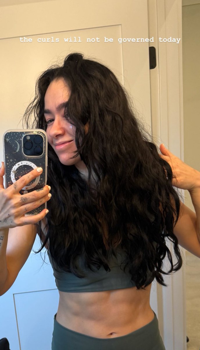 Today the curls are loose, the voice is loud, and they carry absolutely no apologies.