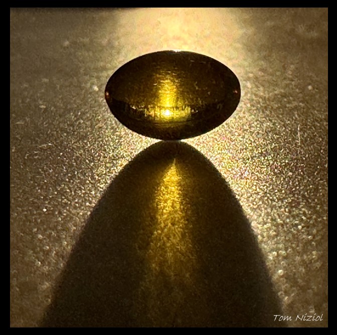 Sunshine makes Vitamin D in our bodies...sun shining through a Vitamin D capsule on my kitchen table this morning :) #HealthyLiving