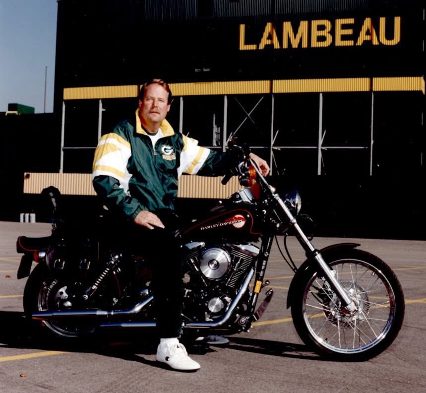 Look at this bad ass on a Harley. Mike Holmgren. I don’t know what year.