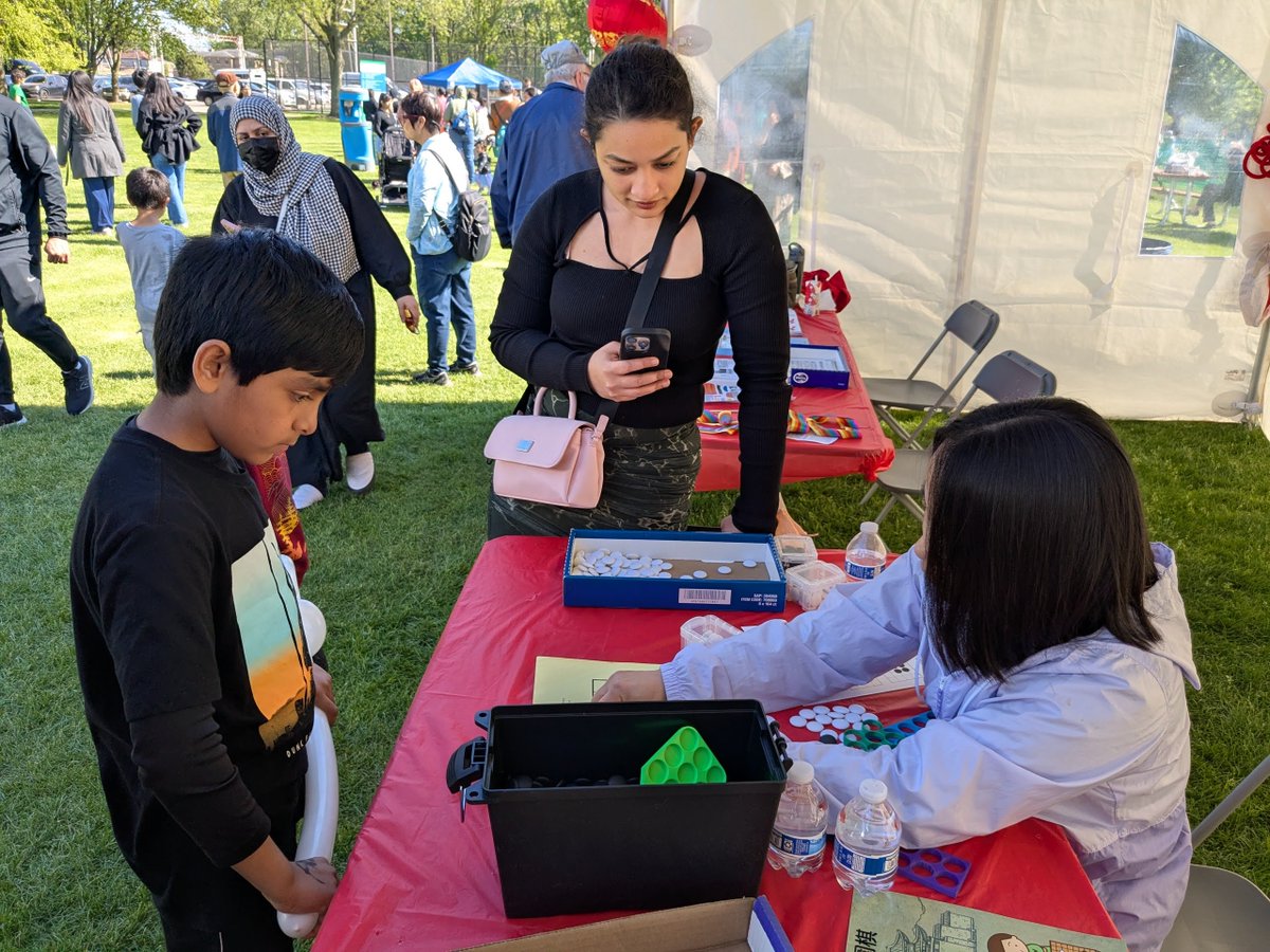 goandmath's tweet image. Visitors at the Skokie Cultural Festival had a chance to learn the ancient and strategic game of Go! Great to see curiosity and smiles as people discovered this timeless board game