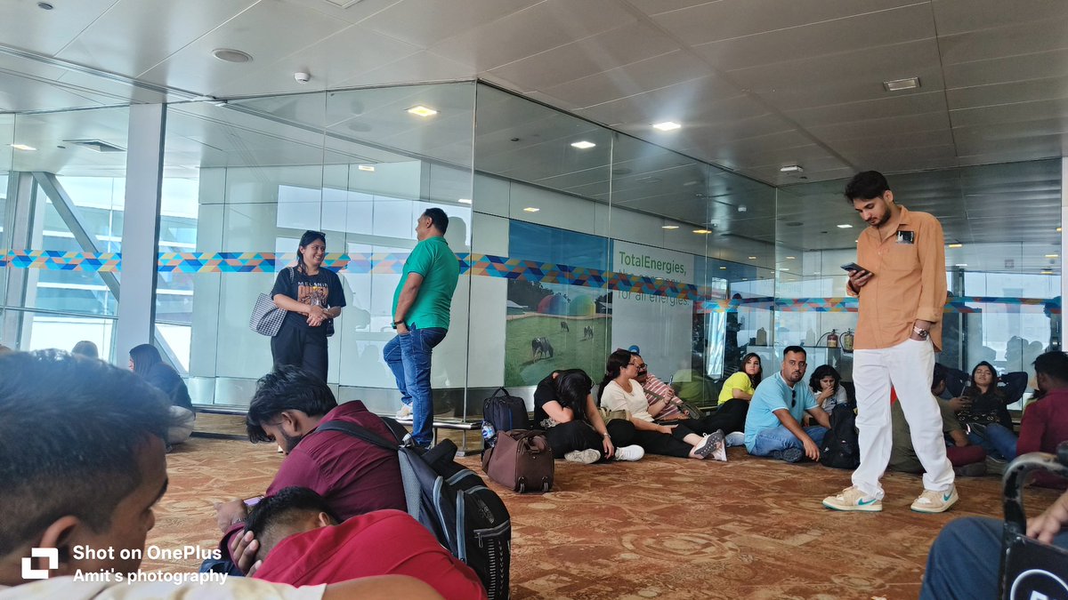 NavaniAmit's tweet photo. @flyspicejet Thank you for the most pathetic experience. All the passengers sitting here  on the floor have similar sentiments. 
SG 11 flight originally schled for 7:45 AM to Dubai and still no updates and no one to update. Thanks for leaving the passengers on the mercy of God. https://t.co/9uSPe5leEW