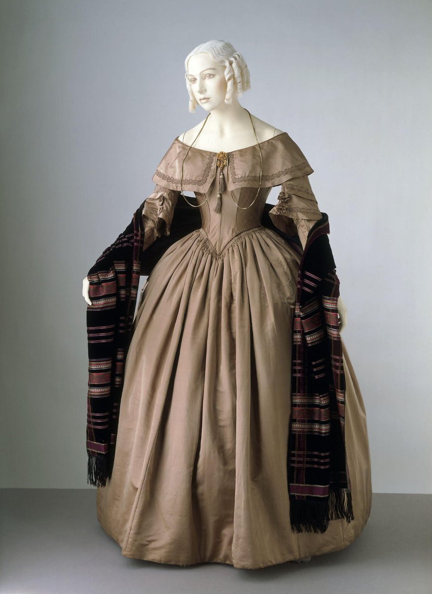 England.

Lovely Dress, c.1842.

Silk satin, lined with cotton, calico and glazed cotton, brass, and reinforced with whalebone. hand sewn.
© <a href="/V_and_A/">V&A</a>
 
#Fashionhistory
