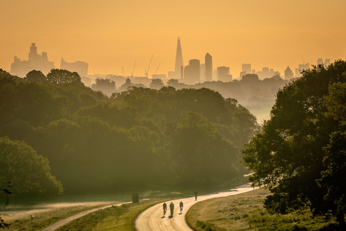 Good morning X. 😊
Here is a shot of some fellow early risers cycling in Richmond Park at sunrise (also featuring a fabulous view of the London skyline)!

<a href="/theroyalparks/">The Royal Parks</a> #sunrise #London