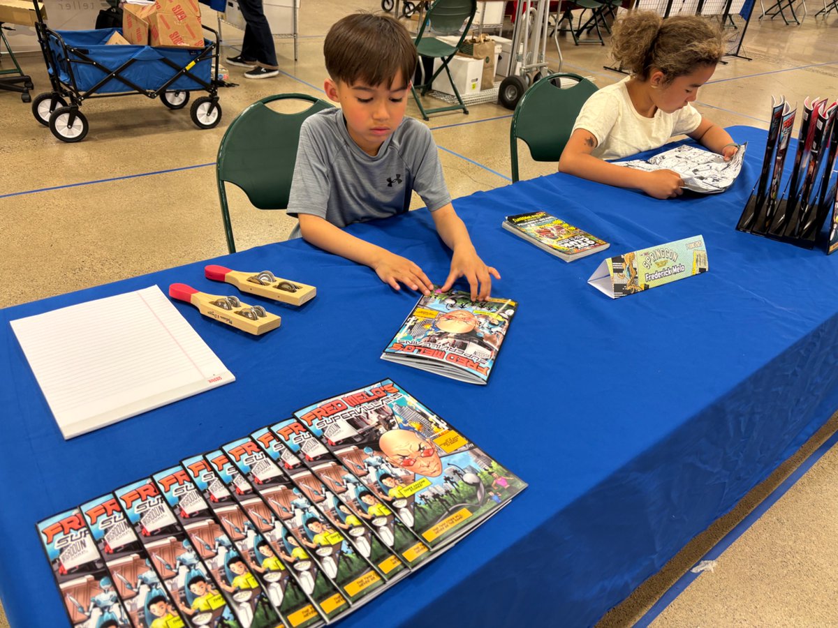 FrederickMelo's tweet photo. The set up the night before… The line around the block this morning… The Minnesota Comic Book Association #MNcBA #SpringCon opens now at the State Fairgrounds, with yours truly in the booth with the best bang for the buck… a $2 local action/drama/killer robots comic! https://t.co/6Uteba7RGl