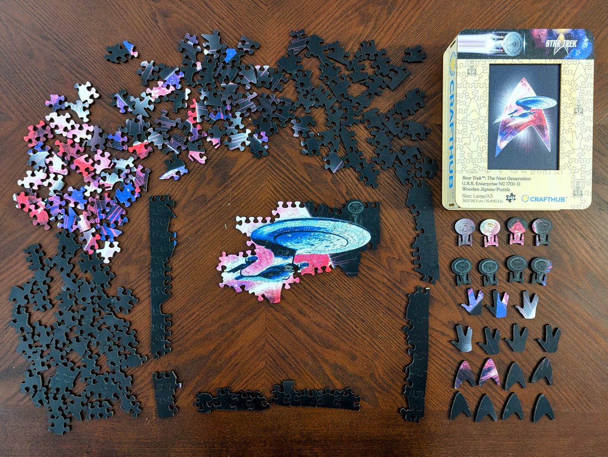 RaD_Adventures's tweet photo. Finished this fun #StarTrek Enterprise-D jigsaw. Great quality wooden puzzle from #CraftHub and love that some pieces are shaped like the ship, Vulcan salute, and delta insignia. Think there are too many solid black pieces. Would have preferred a nice starscape background. ๐งฉ๐ https://t.co/B7ncn0ndtR