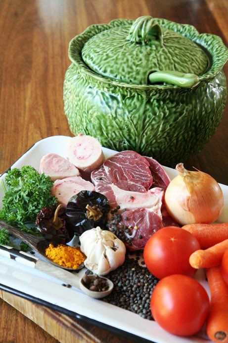 Taking farm-style lensiesop (lentil soup) with marrow bones across the border with poblano chilli, and serve with toasted tortilla strips, strong cheese, lime and cilantro.
