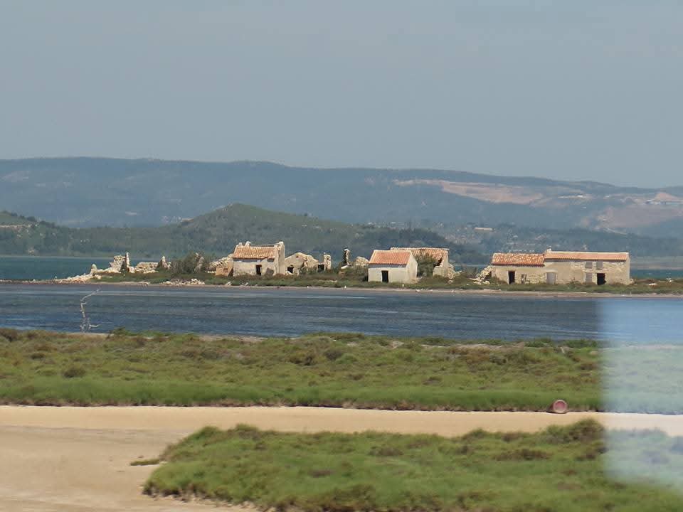 NZAllison's tweet photo. Pictures from the train between Barcelona and Arles. That large grouping of buildings is Beziers.
#BackToFrance https://t.co/oMJ56866Ro