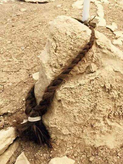 A Yazidi girl cuts her braid and places it on the grave of her lover, who was killed by ISIS. After her lover was killed, the girl decided to take up arms and fight ISIS for revenge.

A rare love scene.