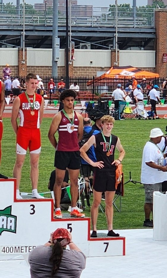 TuskyTrack's tweet image. Wrapping it up right! Junior Abe McElwee on the podium for the Trojans!! Amazing season for our boys and girls!  So very proud of all of our kids!!