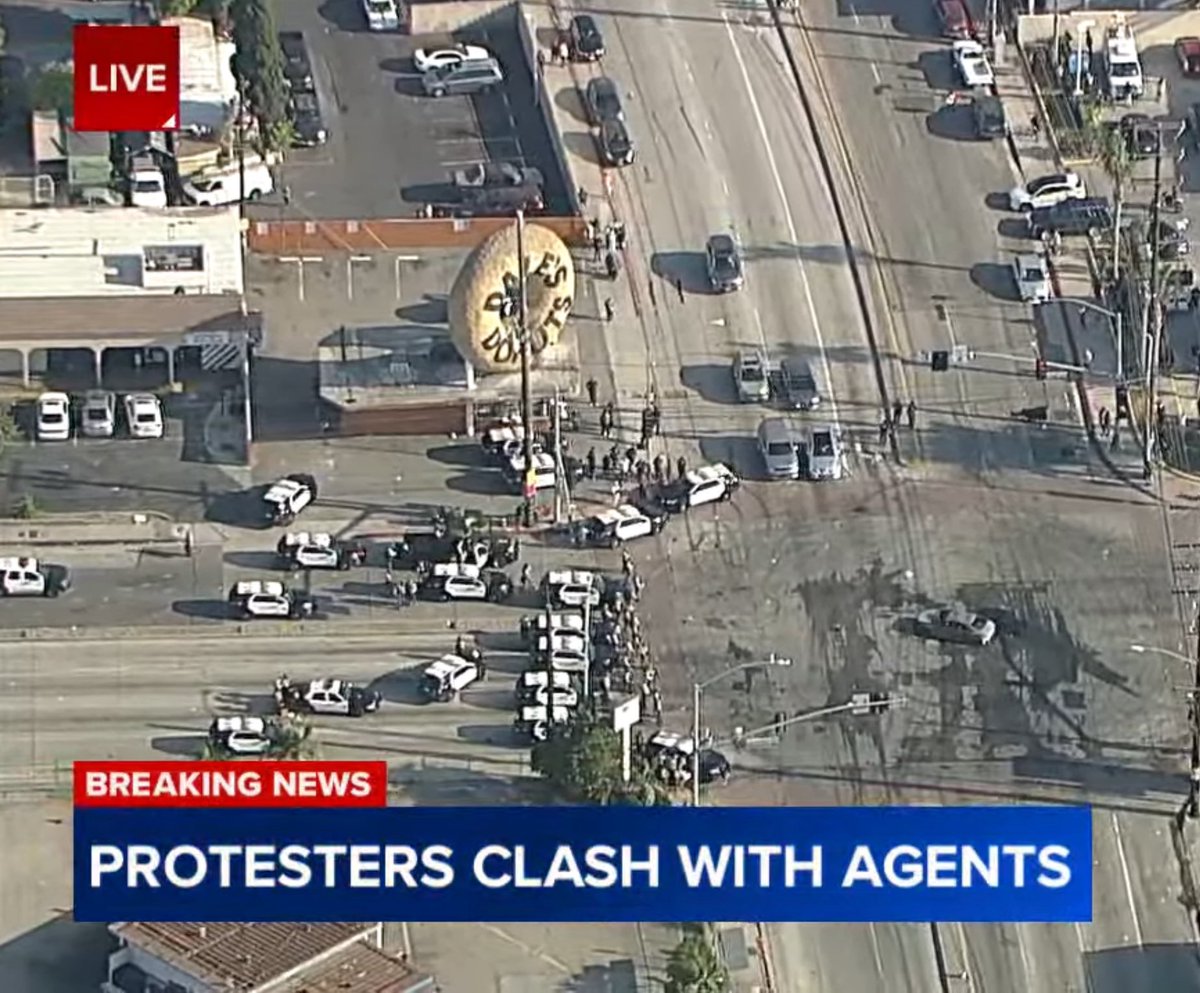 Ironic the Mexicans are at a Home Depot and the police are staging under a giant donut. #LARiots