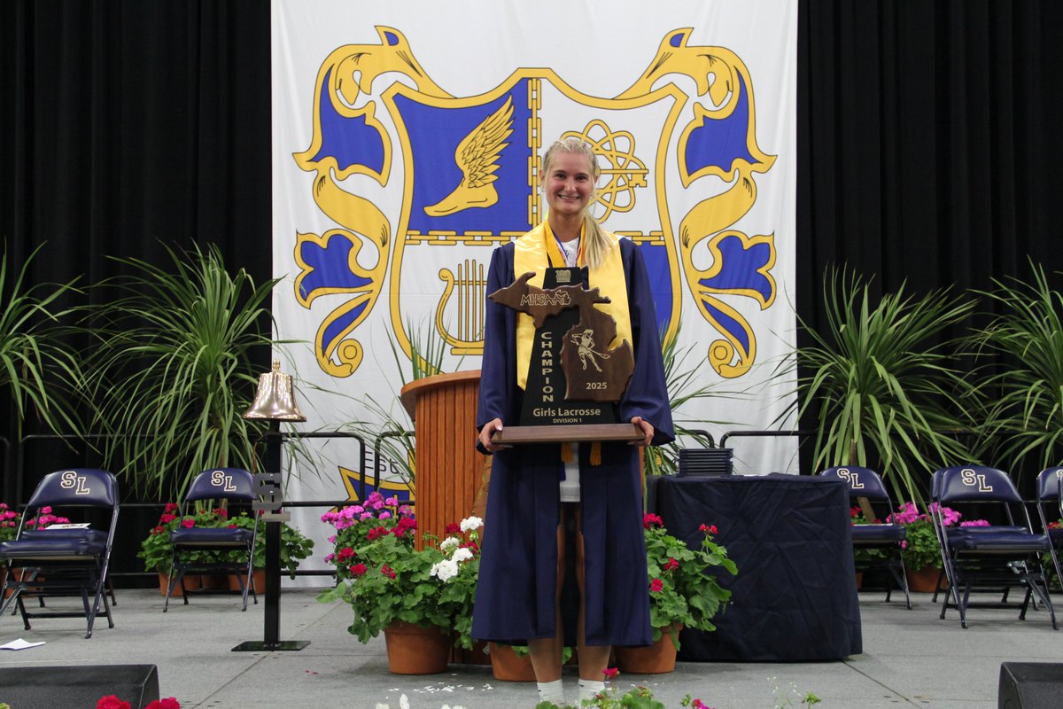 Graduation with trophies--it's a South Lyon Tradition! Congratulations to our softball seniors, who brought the Regional title trophy and Courtney Putnam who came with the Lacrosse State Championship trophy!