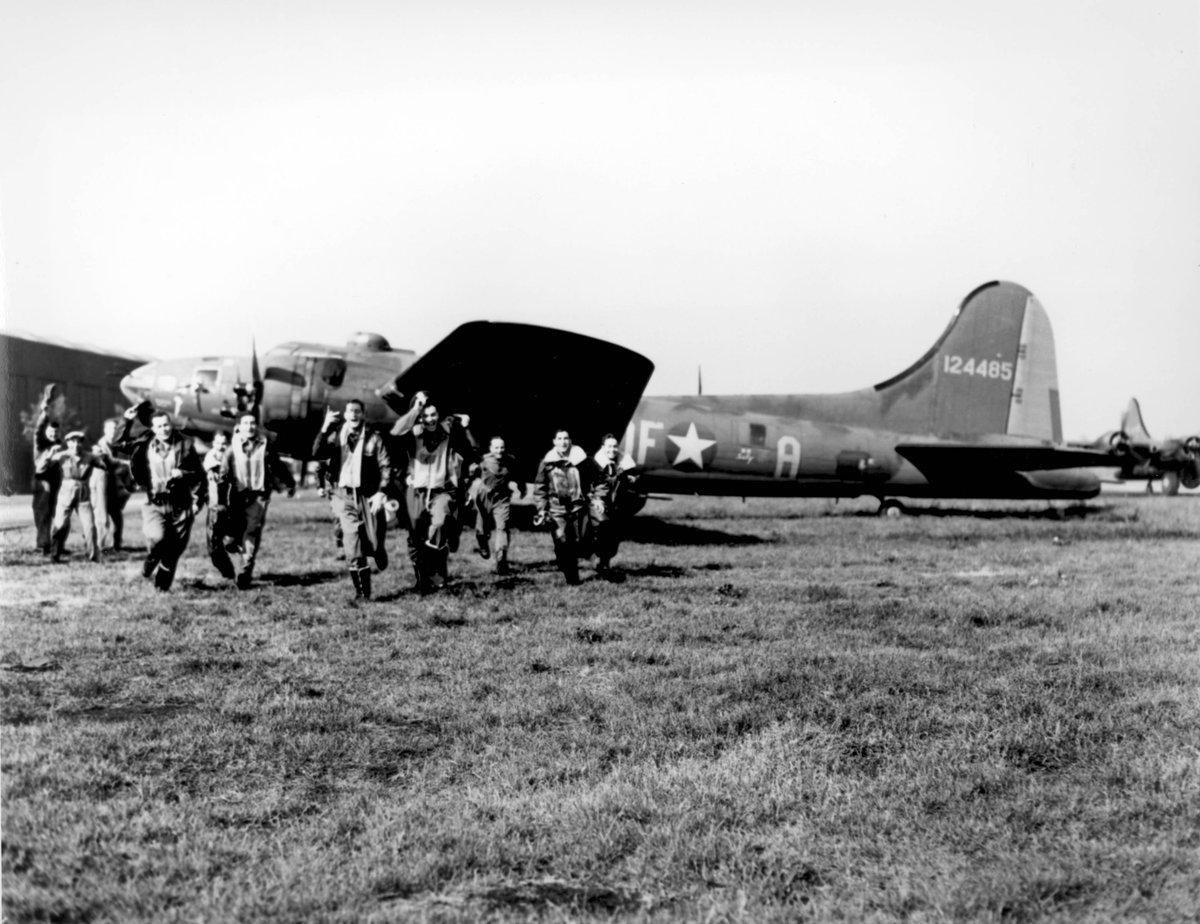 Crew of B-17F Flying Fortress bomber 'Memphis Belle' returning from their 25th mission, England, United Kingdom, 7 Jun 1943