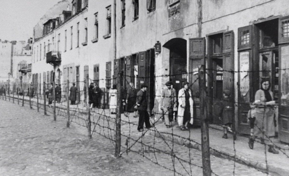 During the Holocaust, the creation of ghettos was a key step in the Nazi process of brutally separating, persecuting, and ultimately destroying Europe's Jews. In the picture, view of a barbed-wire fence separating part of the ghetto in Krakow from the rest of the city.