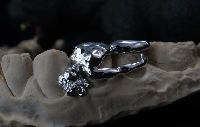 woman in silver by 28 grillz