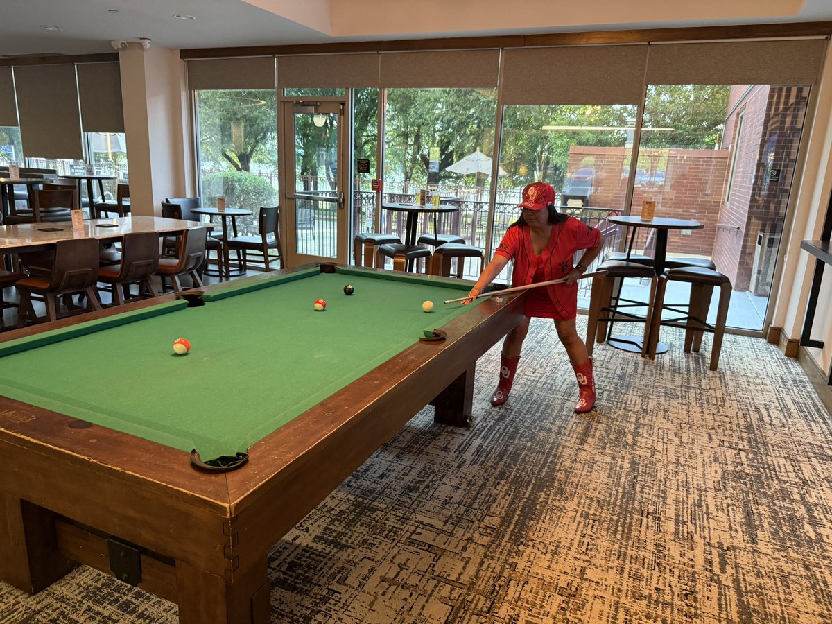 senoroukc's tweet photo. Out here in DFW, absolutely dominating the pool table…wife is winning with her outfit. 😎🎱 
Winning vs. #SeñoraOU but hey—her style points gotta count for something, right? 
#SoonerStyle #DFWNightlife #SeñorOUStrikesAgain #LookingGoodLosingBetter #BoomerSooner #RackEmAndCry https://t.co/OwjpBfK63r