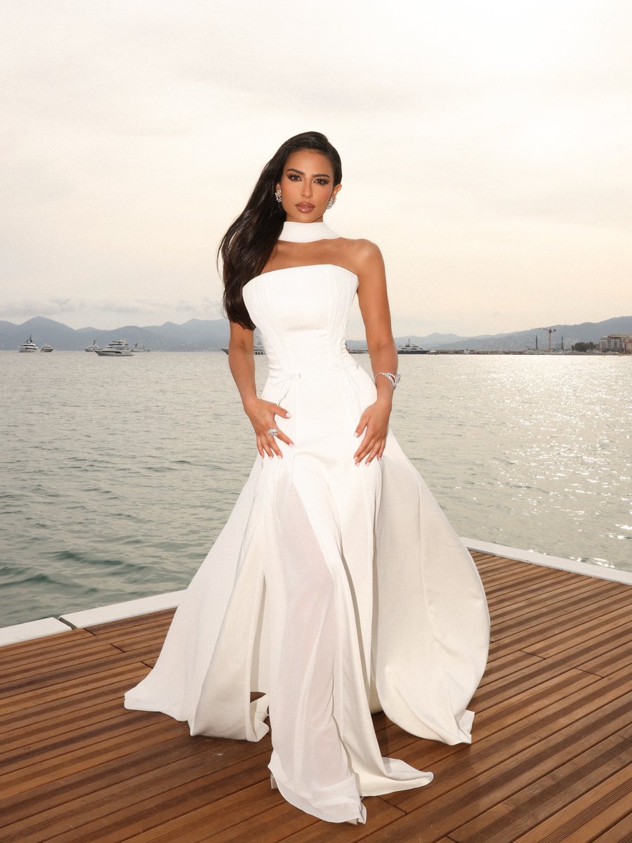 In an off-white strapless crepe satin gown with silk pleating and a flowing neck shawl from the #RamiKadi “Unveiled” bridal RTW collection, #LamaAlAkeel   graced the ‘“Highest 2 Lowest” red carpet at the 78th <a href="/Festival_Cannes/">Festival de Cannes</a>.

#Cannes2025 #Cannes #LamaAlAkeel #RamiKadi