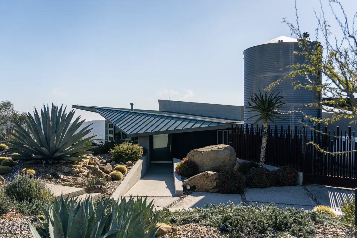 Perched 1,700 ft above Malibu, this bold concrete-and-glass home survived the 2018 Woolsey Fire 🔥—and came back stronger. Its new 10,000+ sq. ft. Hemlock Green metal roof from Taylor Metal is fire-rated, energy-efficient, and built to last. 💪🏠

#metalroofing #metalroof