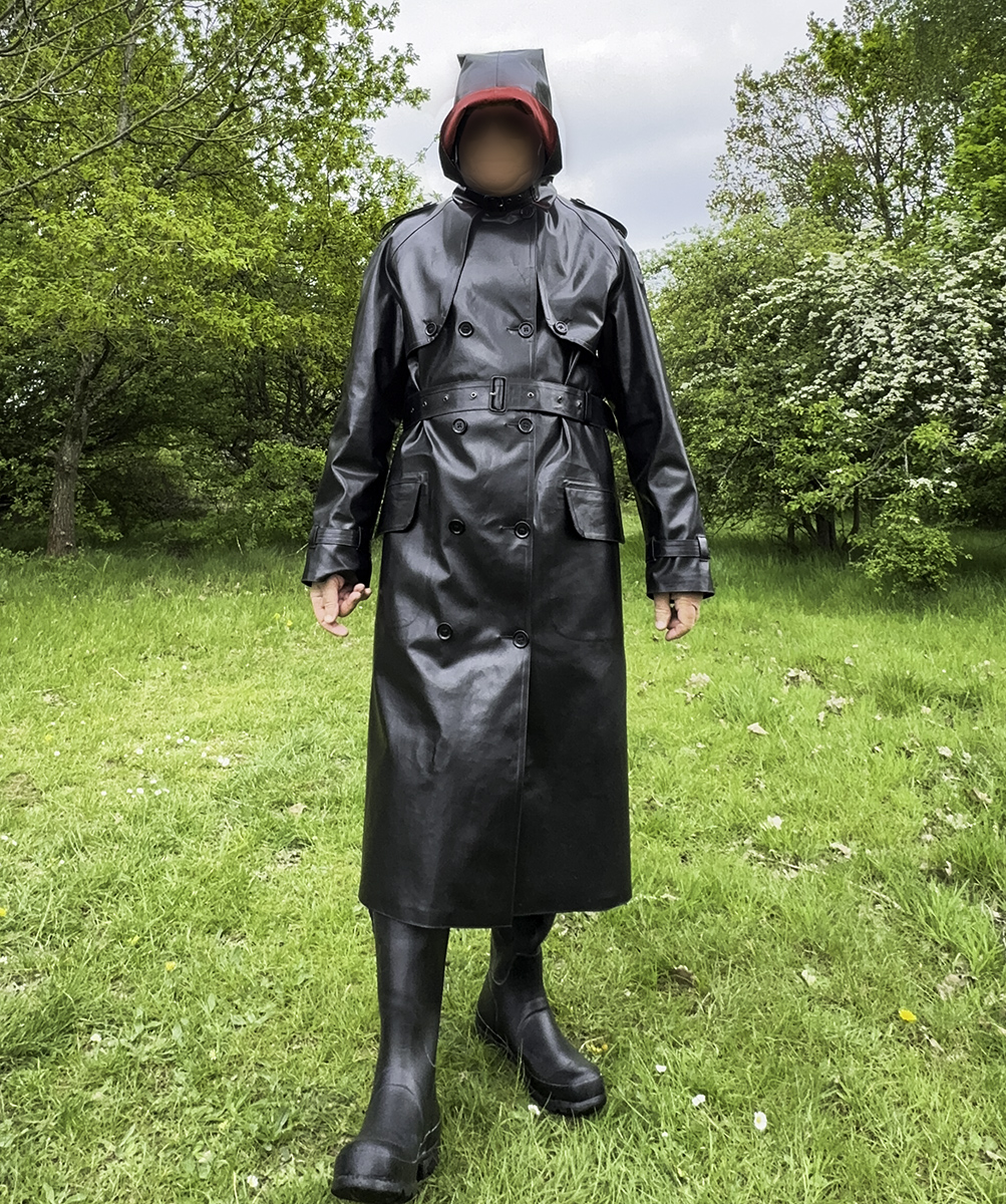 Boy's new rubber mackintosh. It's rubber-lined, too in red rubber. It is a very heavy mackintosh for him to wear - perfect for summers day. 

rainwear rubber mackintosh boots