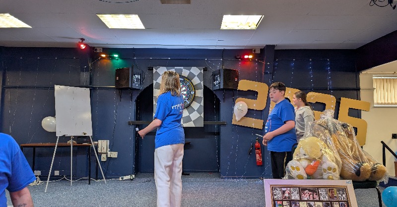 Charlotte and her husband are huge darts fans and decided to organise their own 24 dart marathon back in April! 🎯

 They raised over £2000 in memory of Charlottes friend, Mick by including a raffle on the night. 

Who are you rooting for at tonight's Finals Night?

🧡#MND