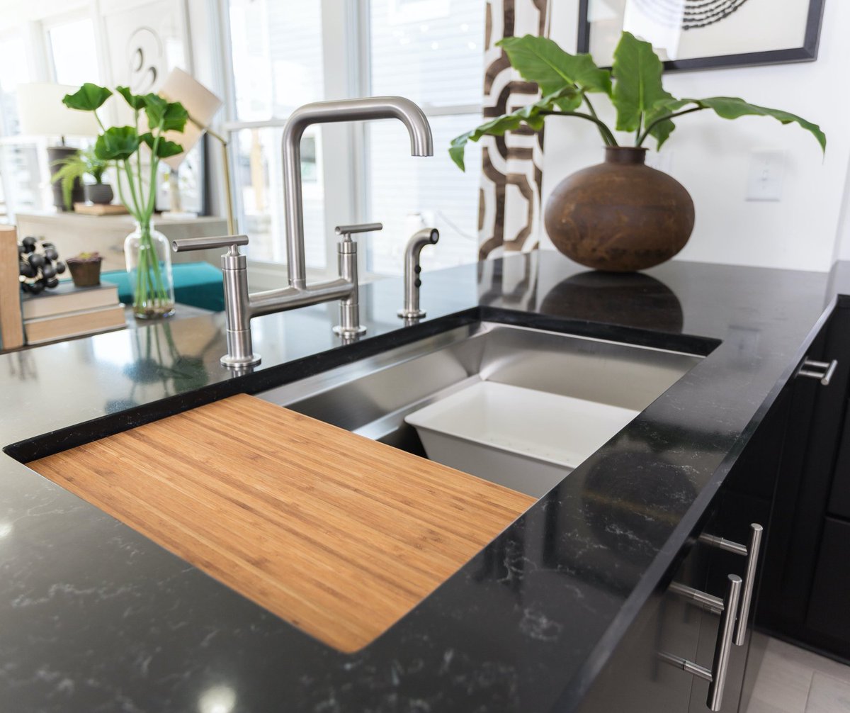 A stunning black stone countertop meets a sleek stainless steel sink for the perfect balance of design and functionality. Cutting Edge Countertops brings your vision to life with premium materials.

Explore more: loom.ly/Gi0dyDI

#KitchenDesign #CuttingEdgeCountertops
