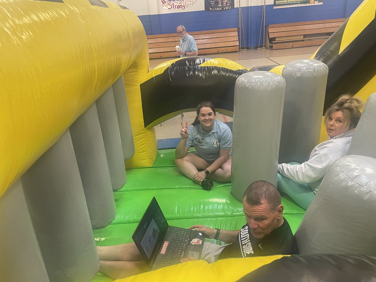 DavidJHuber's tweet photo. Morning announcements on Field Day are so much better from the bounce house!  Thanks Nurse Mary and Miss Tabak for helping out. #sssct https://t.co/j0Okr0m4Es