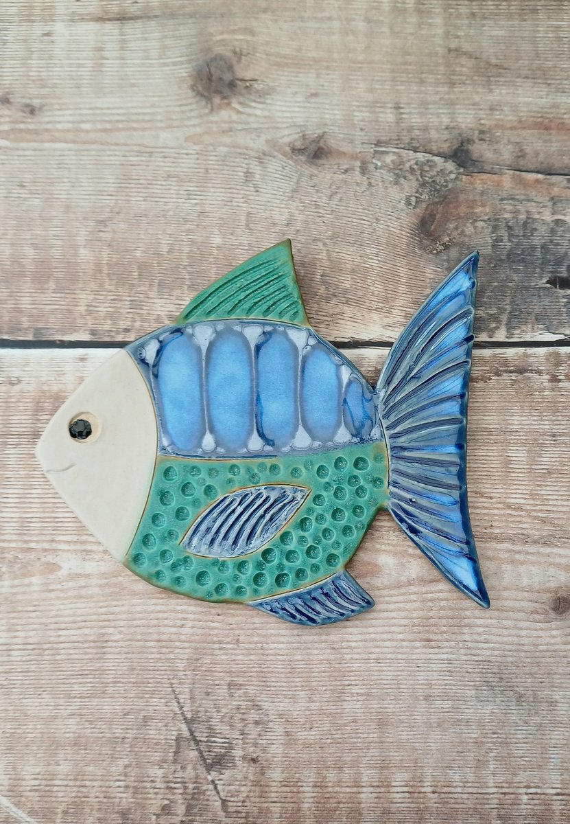 Do people still look on here at nice stuff,  just in case here's something I made, it's in my shop and the link is in my bio. 
Hand made ceramic fish wall decoration