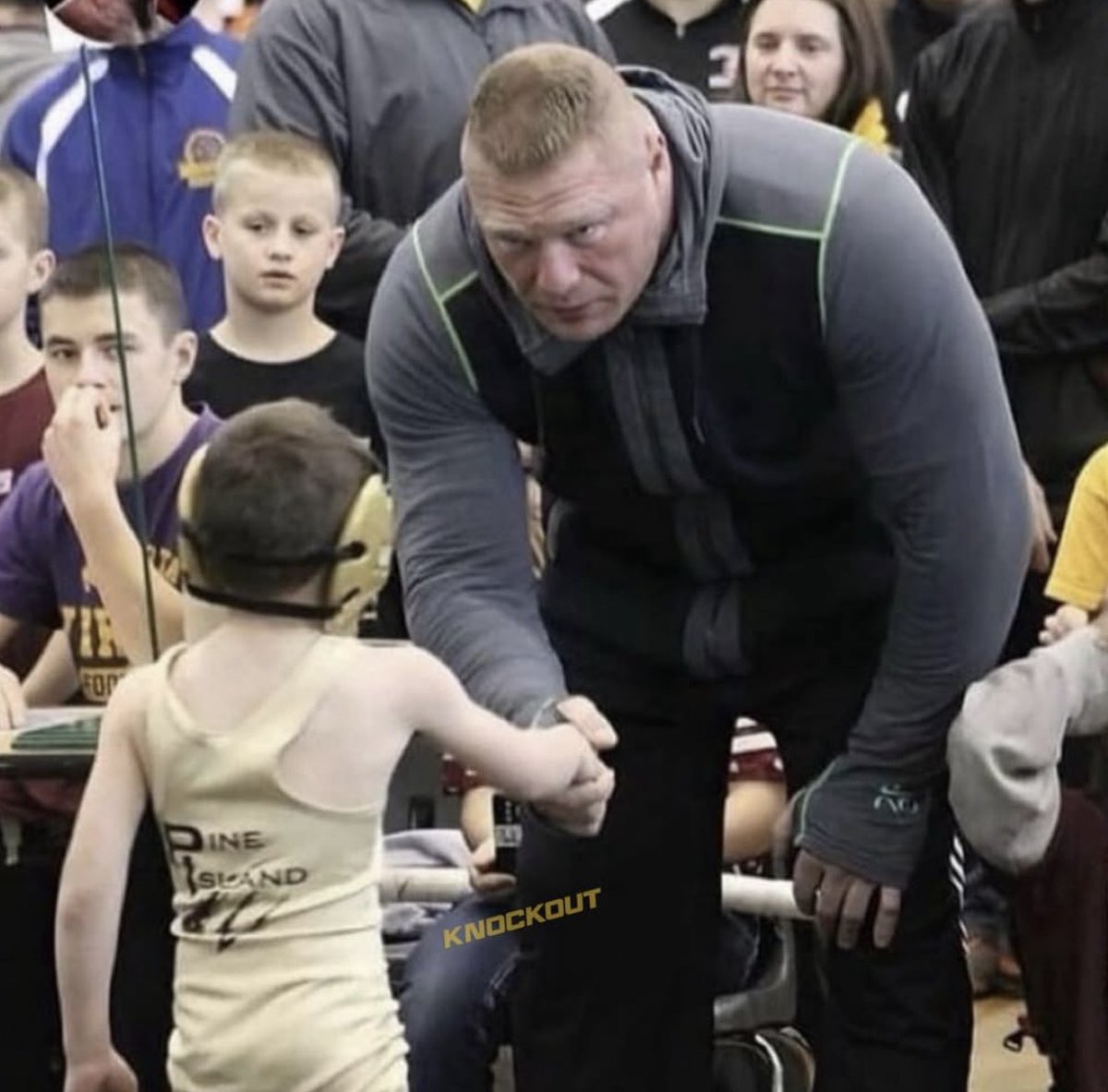 Brock Lesnar shaking hands with the kid that beat his son in a wrestling match