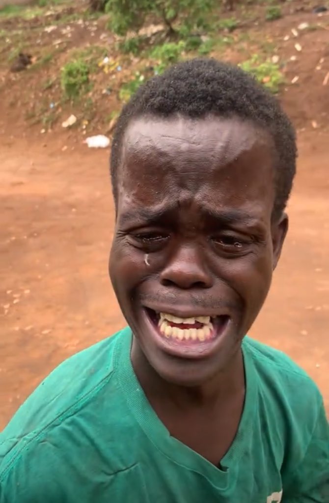 But around midnight, she said something I still hear when I close my eyes, I feel so weak, 
there  was no shower, no doctor, no one to check on her, the pain got worse, her breathing changed.
Then… silence.
She died.
Right there.
In my arms.

Morning came with more irony, Abim