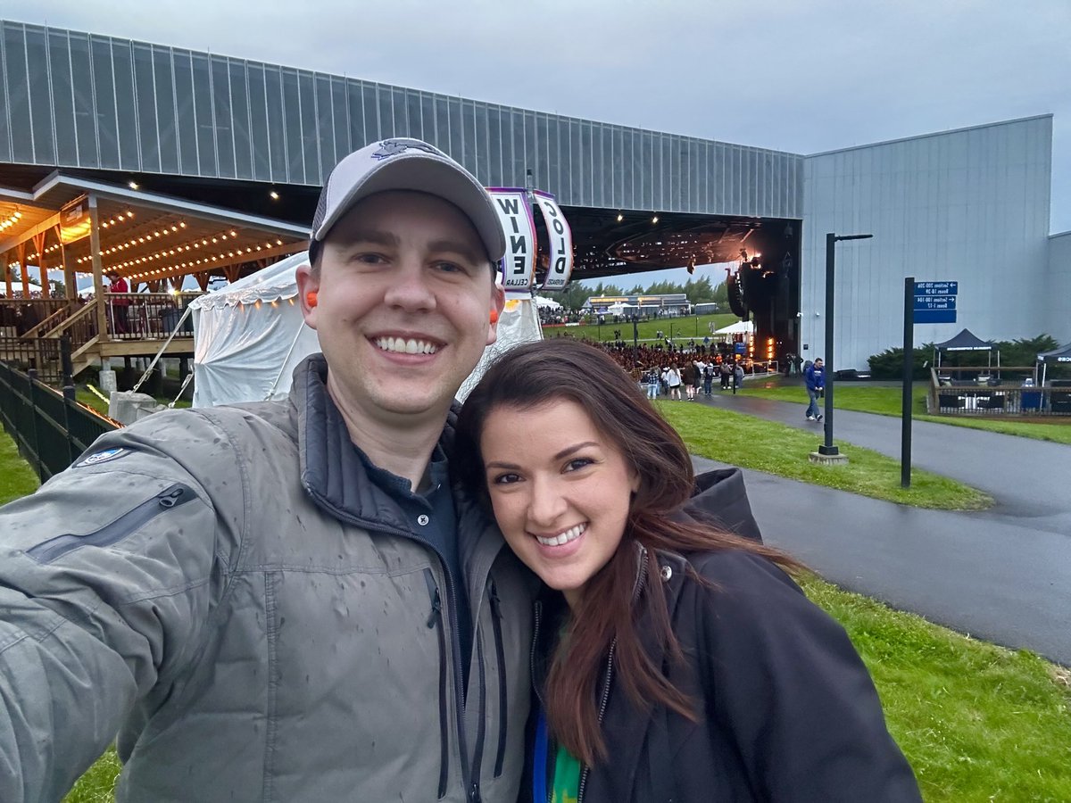 On a cool evening in Syracuse, two news people brave the rain to see Avril Lavigne in concert. Note how only one of us is wearing ear plugs…