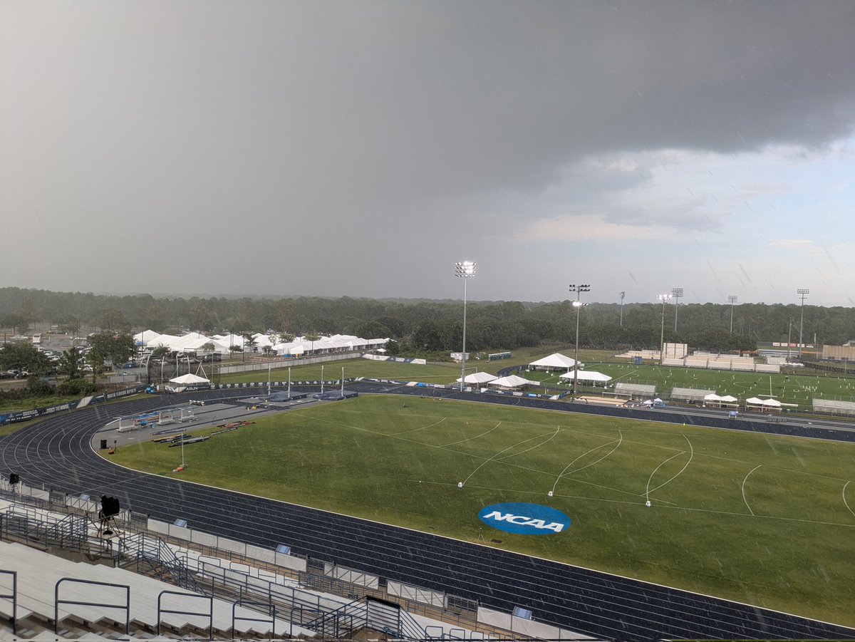 CFreemanJAX's tweet photo. The downpour has begun as NCAA track remains under #LightningDelay. #NCAATF https://t.co/RtNDroGGJc