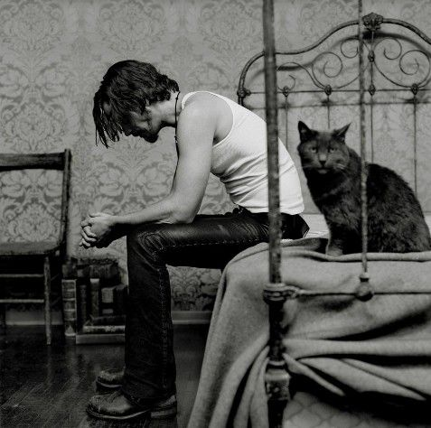 Chris Cornell and his cat. Photograph by Olaf Heine. A powerful photo.